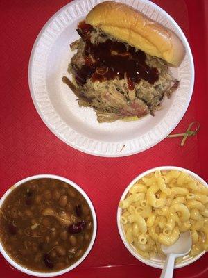 Pulled Pork sandwich. Sides: backed beans, mac & cheese.