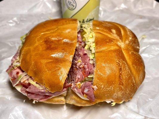 Italian combo deli sandwich on hard roll with drink