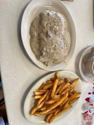 Sausage, biscuits and gravy with a side of french fries