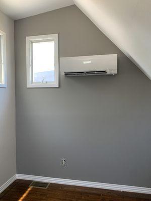 A Mitsubishi mini split wall mount unit install for a small bedroom.