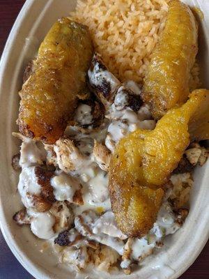 Cajun chicken bowl with plantains and queso