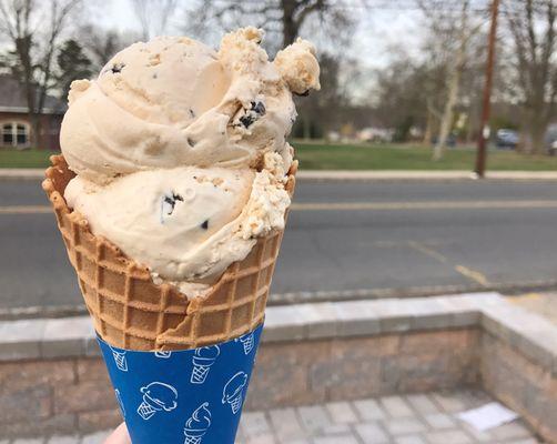 Two scoops of cookie dough. Full all the way to the bottom of the cone.