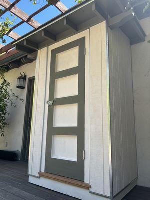 Shed with Shaker style door .