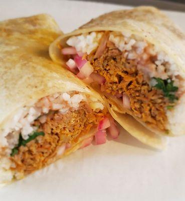 Pork lunch Burrito.  Slowly cooked and shredded pork also know as Cochinita pibil.  A taste of Belize!