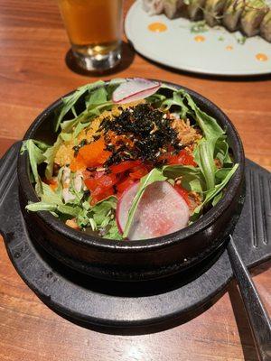 The Donburi there is roe on top, rice, and fish with broth on the bottom.