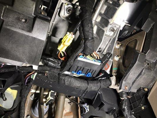 This is an after picture of how our alarm and remote start installations look like once we're finished wiring it all in.