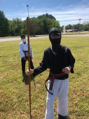 Outside karate class with the bo, masks required!