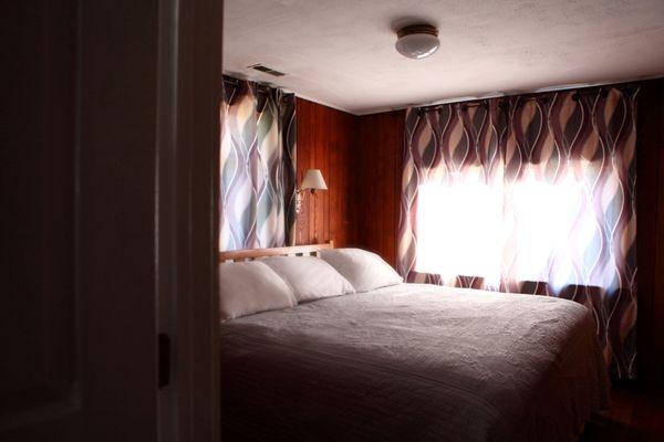 Cottage 15 master bedroom has a king bed.