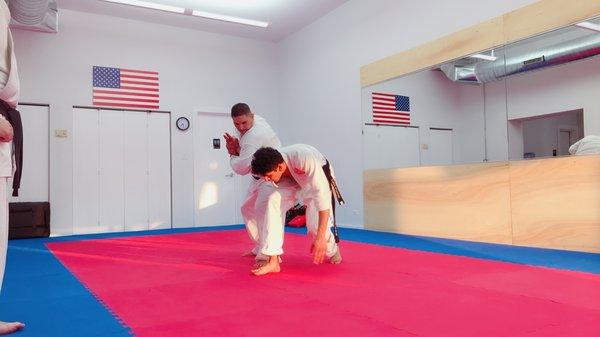 Black belt training - great alignment of his nose, elbow and knee for maximum pressure.