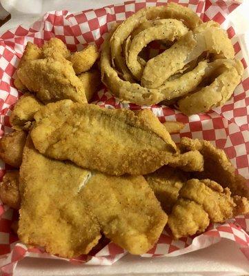 11.99 Friday special Flounder filets with fries and homemade onion rings and squash as the two chosen sides.