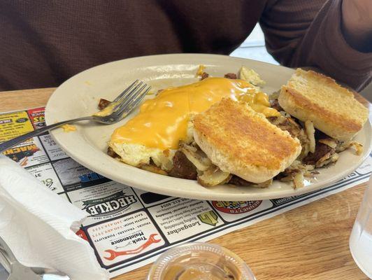 Meat lovers omelette, potatoes and a grilled biscuits