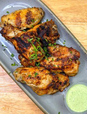 Marinated in our chicken marinate, cooked in an open fire grill and served with Ecuadorian basil green sauce.