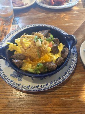 Hash brown casserole bowl with steak