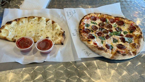 Delicious lunch today.  Margarita pizza (add cupped pepperoni), with 1/2 garlic cheese Bread (two amazing fresh marinara dippers).