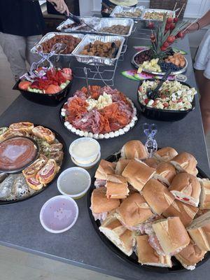 A delicious spread of assorted salads and sandwiches