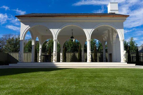 Artificial grass in front of a gorgeous marble pavilion.