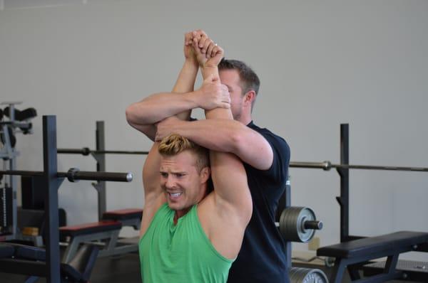 Hands on stretching is included in every session at J and K Fit!