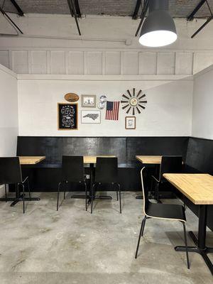 Communal seating that they have in hallway between them and the new juice bar