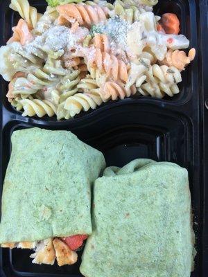 European wrap with onions added and a side of pasta salad.