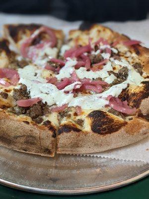 Greek pizza... lamb sausage, pickled onions, tzaziki.... very good