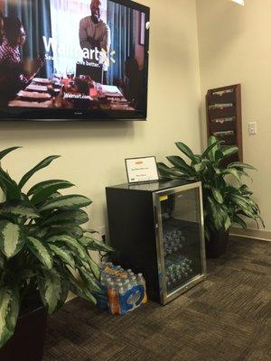 Big t.v. And complimentary water in waiting area