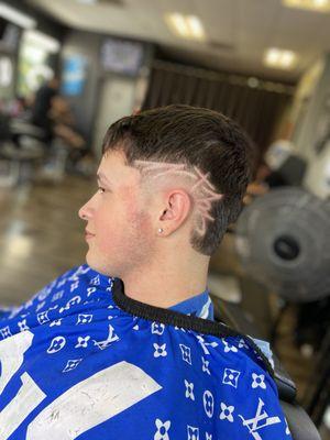 Mid burst fade with design by Chucky