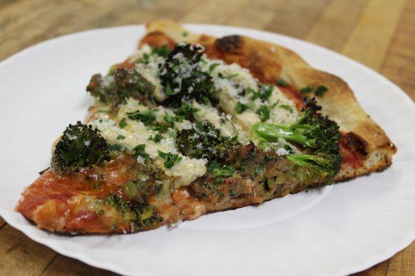 House made broccoli sausage, roasted broccoli florets, and a charred broccoli and pepperoncini juice crema. All on a pizza.