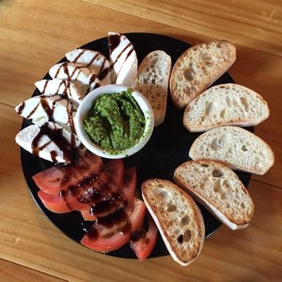 Caprese salad with pesto spread.