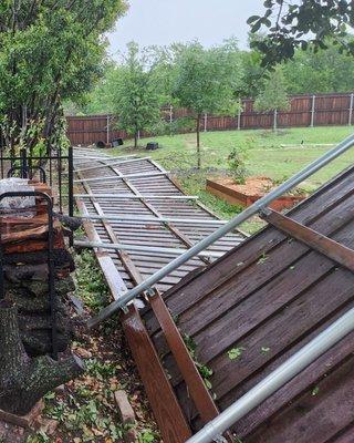 This is what happens when you don't bother to set the posts on 150+ feet of fence.  North Texas Fence & Deck, LLC - y'all should be proud.