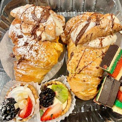 Two cannoli filled lobster tails, two fruit tarts, and random other awesome treats.