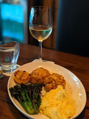 Jumbo Lump Crab Cakes with charred broccolini and herb mashed potatoes with key-lime mustard