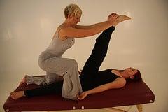 Thai yoga massage can be given on the massage table. Yummy hamstring stretch!