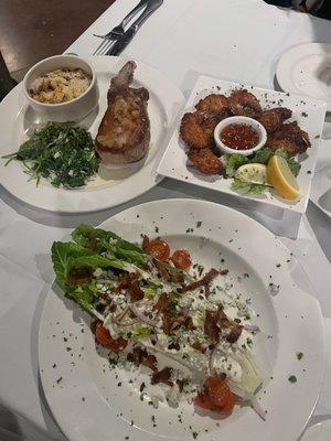 Wedge salad, coconut shrimp, pork chop