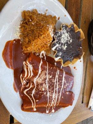 2 cheese enchiladas rojas with a side of rice and black beans.