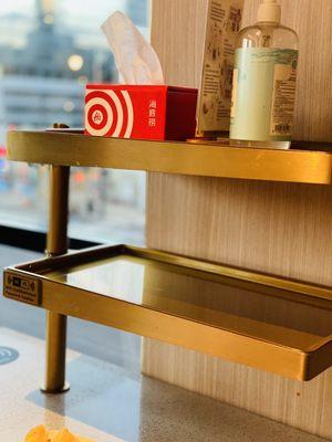 Shelves to place your items to reduce clutter on the table