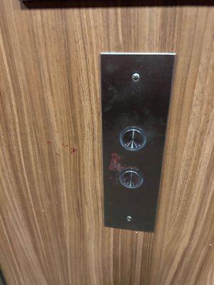 blood on the elevator buttons