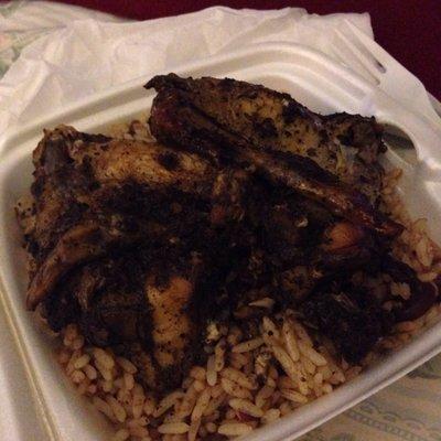 Jerk wings over rice and beans