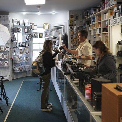 A normal day at the shop. We can answer any of your questions and help find the perfect camera suited for you!