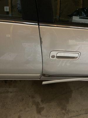 Photo 1 of right front, rear door edge damage.