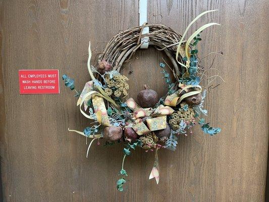 The absolute UGLIEST door wreath on planet Earth.