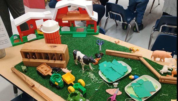 It's Farm Day at Mommy/Daddy and Me! Toddlers discussed the animals and tools and their roles on the farm with their parents.