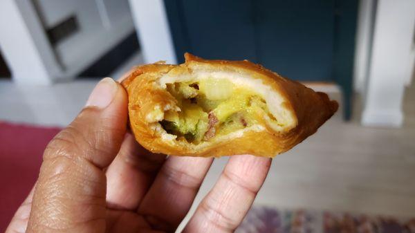 Interior of veggie samosa ($5), vegan by default. Oily/bland. Didn't love the mushy interior.