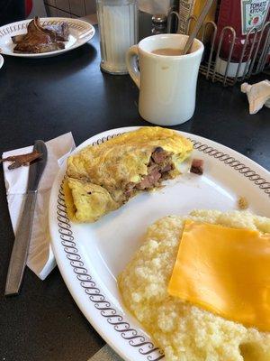 The waiter had an attitude that we didn't want it.  The. There was so much butter put into the grits that we'd get sick!