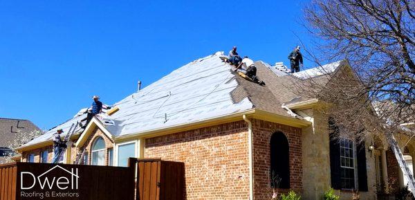 Replacing a roof in Plano with upgraded components such as synthetic underlayment and Ice & Watershield for leak proofing. Roof Replacement