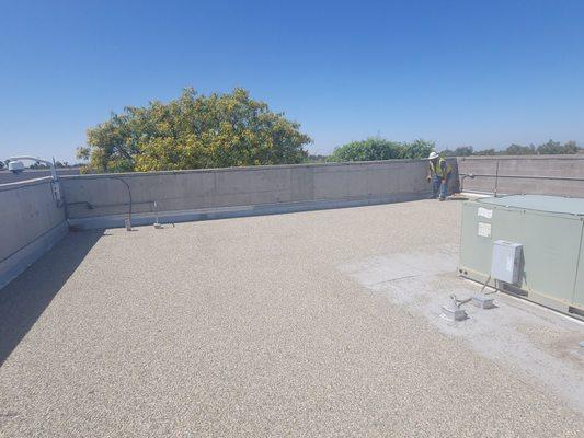 Inspector on commercial roof.