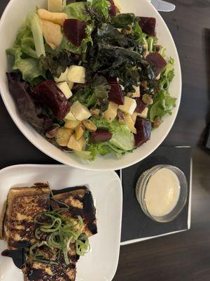 Glazed tofu with a fresh salad (apples, pistachios, cheddar cheese, and their homemade apple cider vinaigrette)