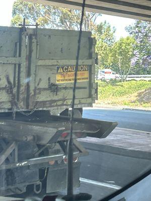 Rocks falling off of their transport truck. They were delivering it to a customer.