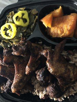 This is a photo of collard greens, jerk chicken and rice and peas and sweet potatoes!