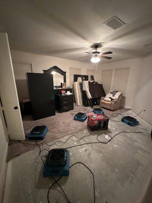 Emergency setting of fans and dehumidifiers in order to dry the walls from an upstairs attic water heater leak.