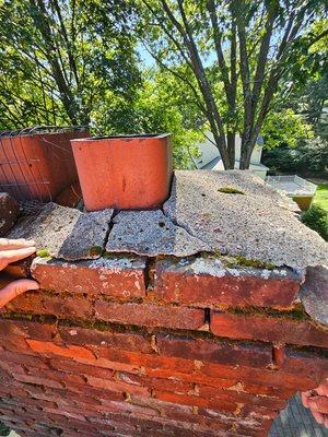 Old cracked broken crown on top of chimney